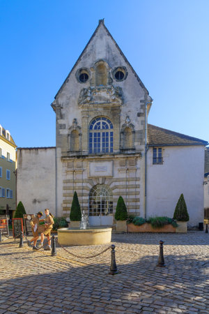 BEAUNE, FRANCE - OCTOBER 15, 2016: Scene of Ziem square and St. Etienne church, with boy scouts selling calendars, in Beaune, Burgundy, Franceのeditorial素材
