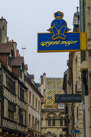 DIJON, FRANCE - OCTOBER 14, 2016: Street scene with typical old houses, and typical signs, in Dijon, Burgundy, Franceのeditorial素材