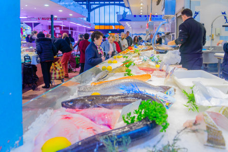 DIJON, FRANCE - OCTOBER 14, 2016: Market scene with various fish and seafood, sellers and shoppers, in Dijon, Burgundy, Franceのeditorial素材