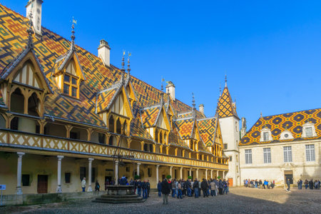 BEAUNE, FRANCE - OCTOBER 15, 2016: The Hospices of Beaune (historic hospital), with visitors, in Beaune, Burgundy, Franceのeditorial素材