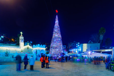 NAZARETH, ISRAEL - DECEMBER 20, 2016: Christmas scene of Mary Well square, with the Greek Orthodox Church of the Annunciation, a Christmas tree, locals and tourists, in Nazareth, Israelのeditorial素材