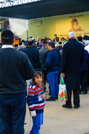 NETIVOT, ISRAEL - JANUARY 30, 2017: Jewish men attend a ceremony near the Rabbi Israel Abuhatzeira (Baba Sali) tomb, as part of the annual hillula of his memory. In Netivot, Israelのeditorial素材