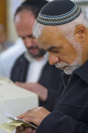 NETIVOT, ISRAEL - JANUARY 30, 2017: Jewish men pray at the Rabbi Israel Abuhatzeira (Baba Sali)...