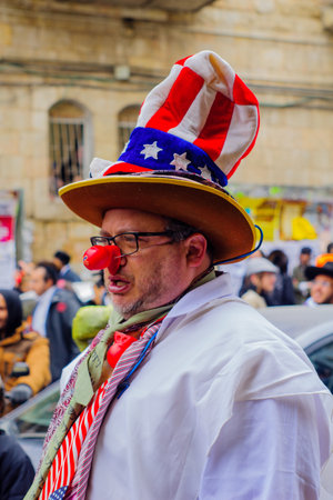 JERUSALEM, ISRAEL - MARCH 13, 2017: Ultra-orthodox Jewish men, some in costumes, as part of a celebration of the Jewish Holyday Purim, in the Mea Shearim neighborhood, Jerusalem, Israelのeditorial素材