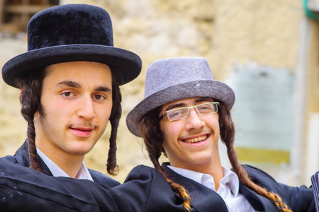 JERUSALEM, ISRAEL - MARCH 13, 2017: Ultra-orthodox Jewish men, some in costumes, as part of a celebration of the Jewish Holyday Purim, in the Mea Shearim neighborhood, Jerusalem, Israelのeditorial素材