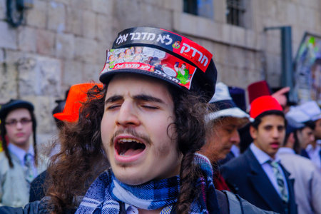 JERUSALEM, ISRAEL - MARCH 13, 2017: Ultra-orthodox Jewish men, some in costumes, as part of a...