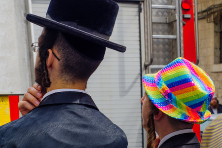 JERUSALEM, ISRAEL - MARCH 13, 2017: Ultra-orthodox Jewish men, some in costumes, as part of a celebration of the Jewish Holyday Purim, in the Mea Shearim neighborhood, Jerusalem, Israelのeditorial素材