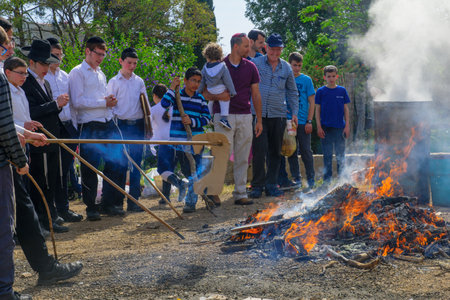 HAIFA, ISRAEL - APRIL 10, 2017: Jewish people perform Biur (burning) Chametz (leavened foods), in Haifa, Israel. This is part of the Passover holiday traditionsのeditorial素材