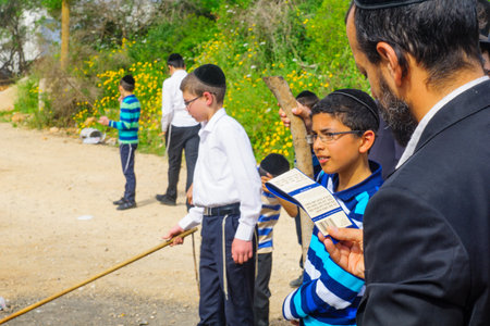HAIFA, ISRAEL - APRIL 10, 2017: Jewish people perform Biur (burning) Chametz (leavened foods), and say blessing, in Haifa, Israel. This is part of the Passover holiday traditionsのeditorial素材