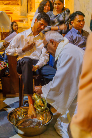 HAIFA, ISRAEL - APRIL 13, 2017: Washing of the feet ceremony, on Holy Thursday, part of Easter celebration, in the Church of Stella Maris Carmelite Monastery (Our Lady of Mount Carmel), Haifa, Israelのeditorial素材