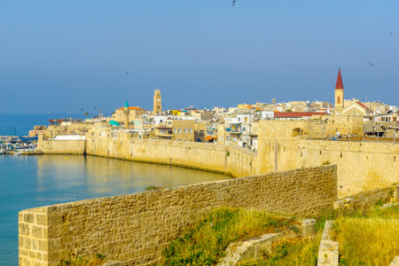 ACRE, ISRAEL - APRIL 27, 2017: View of the city walls, the fishing harbor, and the old city skyline, in Acre (Akko), Israelのeditorial素材