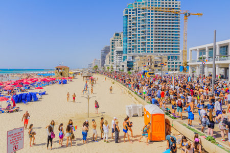 TEL-AVIV, ISRAEL - JUNE 09, 2017: Crowd and dancers on a truck take part in the annual pride parade of the LGBT community, in the streets of Tel-Aviv, Israelのeditorial素材