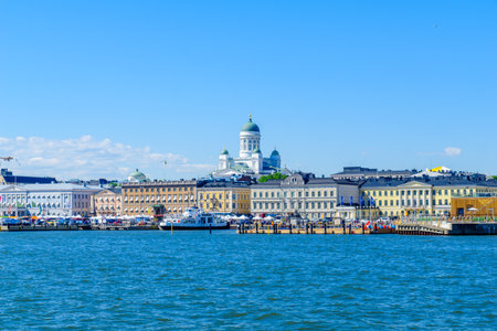 HELSINKI, FINLAND - JUNE 15, 2017: Scene of the south harbor, and the Lutheran Cathedral in the background, with locals and visitors, in Helsinki, Finlandのeditorial素材