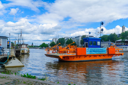 TURKU, FINLAND - JUNE 23, 2017: Scene of the Aura river, with the Fori ferry and passengers, in Turku, Finlandのeditorial素材