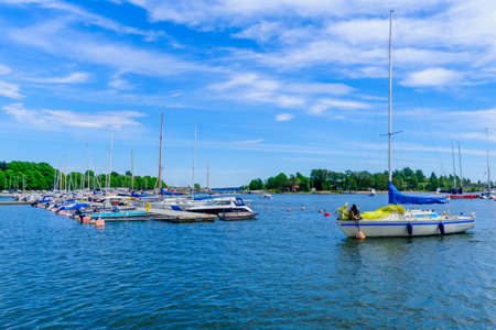 HELSINKI, FINLAND - JUNE 16, 2017: View of the Merisatama port, with various boats, locals and visitors, in Helsinki, Finlandのeditorial素材
