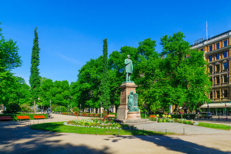 HELSINKI, FINLAND - JUNE 16, 2017: View of the Esplanade Park and the Runeberg Statue, with locals and visitors, in Helsinki, Finlandのeditorial素材