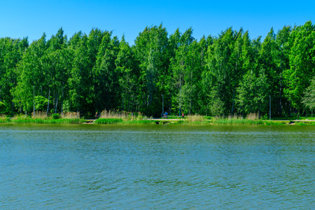 HELSINKI, FINLAND - JUNE 15, 2017: View of the coast promenade of Tammisalo island, with visitors, in Helsinki, Finlandのeditorial素材