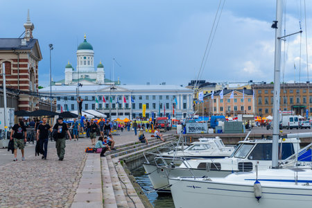 HELSINKI, FINLAND - JUNE 15, 2017: Scene of the south harbor, with the market, the city hall, the Lutheran Cathedral in the background, locals and visitors, in Helsinki, Finlandのeditorial素材