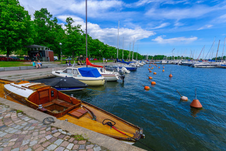 HELSINKI, FINLAND - JUNE 16, 2017: View of the Merisatama port, with various boats, locals and visitors, in Helsinki, Finlandのeditorial素材