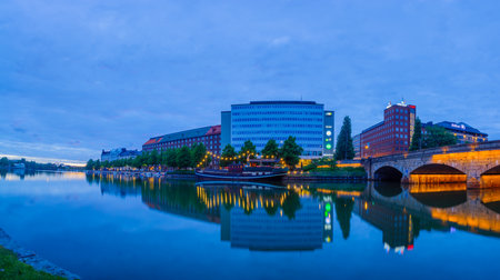 HELSINKI, FINLAND - JUNE 23, 2017: Night view of kaisaniemenlahti bay, with local businesses, locals and visitors, in Helsinki, Finlandのeditorial素材