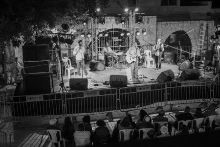 SAFED, ISR - AUG 23, 2017: Group of musicians (Yehuda Katz) and crowd at the Klezmer Festival in Safed (Tzfat), Israel. Its the 30th annual traditional Jewish festival in the public streets of Safedのeditorial素材