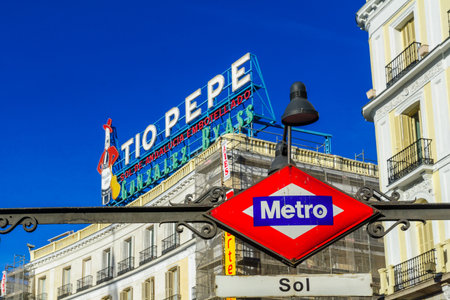MADRID, SPAIN - JANUARY 1, 2018: View of Puerta del Sol square, with the Tio Pepe sign, and the Metro station sign, in Madrid, Spainのeditorial素材