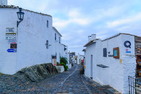 MONSARAZ, PORTUGAL - DECEMBER 30, 2017: View of an alley in the historic village, with local businesses, in Monsaraz, Portugalのeditorial素材