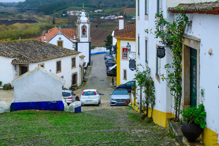 OBIDOS, PORTUGAL - DECEMBER 28, 2017: View of alleys in the old town, with local businesses, in Obidos, Portugalのeditorial素材