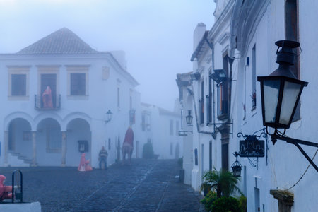 MONSARAZ, PORTUGAL - DECEMBER 30, 2017: View of Direita street (the main street) in the historic village, with local businesses, in Monsaraz, Portugalのeditorial素材