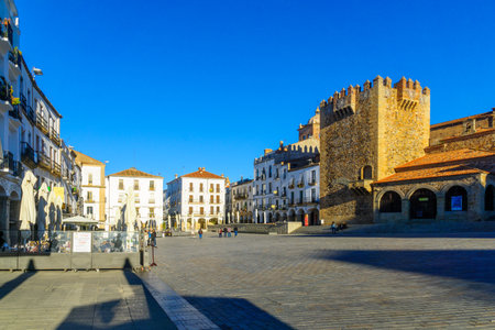 CACERES, SPAIN - DECEMBER 21, 2017: Scene of the Plaza Mayor (main square), with local businesses, locals and visitors, in Caceres, Extremadura, Spainのeditorial素材
