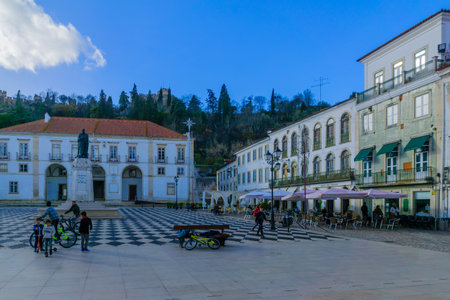 TOMAR, PORTUGAL - DECEMBER 27, 2017: Scene of the main square (praca da republica), and the town hall, with locals and visitors, in Tomar, Portugalのeditorial素材