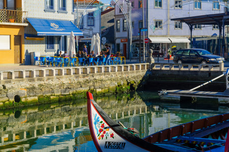 AVEIRO, PORTUGAL - DECEMBER 23, 2017: View of canals, boats, colorful houses, local businesses, locals and visitors, in Aveiro, Portugalのeditorial素材