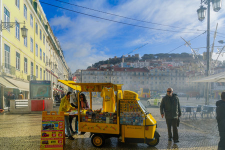 LISBON, PORTUGAL - DECEMBER 29, 2017: Scene of the Figueira square, with local businesses, locals and visitors, in Lisbon, Portugalのeditorial素材