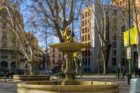 MADRID, SPAIN - JANUARY 1, 2018: View of fountains in Paseo del Prado boulevard, with locals and visitors, in Madrid, Spainのeditorial素材