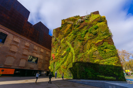 MADRID, SPAIN - JANUARY 1, 2018: View of the vertical garden of CaixaForum, with locals and visitors, in Madrid, Spainのeditorial素材