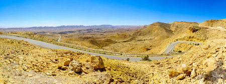 Panoramic landscape and winding road 225 in HaMakhtesh HaGadol (the big crater). It is a geological...