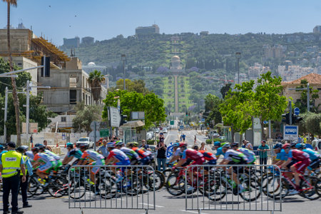 HAIFA, ISRAEL - MAY 05, 2018: Scene of stage 2 of 2018 Giro d Italia, with cyclists and spectators, and the German Colony, Bahai gardens and shrine in the background. Haifa, Israelのeditorial素材