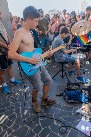 TEL-AVIV, ISRAEL - JUNE 08, 2018: People play music to the celebrating crowd in the annual pride parade of the LGBT community, in Tel-Aviv, Israelのeditorial素材