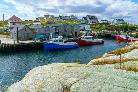Peggys Cove, Canada - September 22, 2018: Scene of the fishing village, with wooden houses, boats and tourists, in Peggys Cove, in Nova Scotia, Canadaのeditorial素材