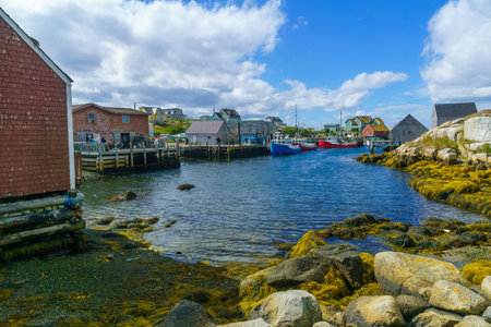 Peggys Cove, Canada - September 22, 2018: Scene of the fishing village, with wooden houses, boats and tourists, in Peggys Cove, in Nova Scotia, Canadaのeditorial素材