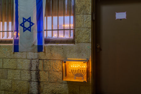 Jerusalem, Israel - December 09, 2018: Traditional Menorahs (Hanukkah Lamps) with olive oil candles, placed near the entrance, in the Jewish quarter, Jerusalem Old City, Israelのeditorial素材