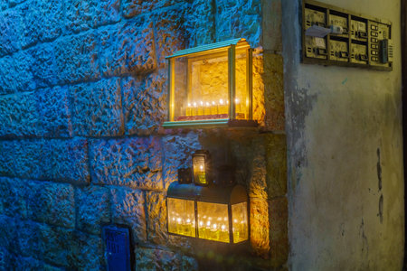 Jerusalem, Israel - December 09, 2018: Traditional Menorahs (Hanukkah Lamps) with olive oil candles, placed near the entrance, in the Jewish quarter, Jerusalem Old City, Israelのeditorial素材