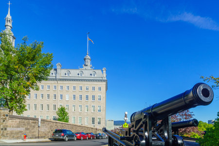 View of old gun and the historic Seminaire de Quebec building in Quebec City, Quebec, Canadaのeditorial素材