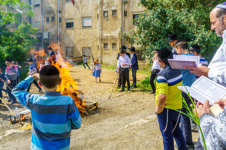 Haifa, Israel - April 19, 2019: Jewish people perform Biur (burning) Chametz (leavened foods), and say blessing, in Haifa, Israel. This is part of the Passover holiday traditionsのeditorial素材