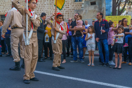 Haifa, Israel - April 27, 2019: Scouts perform a Holy Saturday parade, and crowd attend and hold the holy fire, part of Orthodox Easter celebration in Haifa, Israelのeditorial素材
