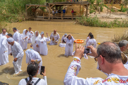 Qasr el Yahud, West Bank - April 24, 2019: Pilgrims baptize in Qasr el Yahud (Castle of the Jews),...