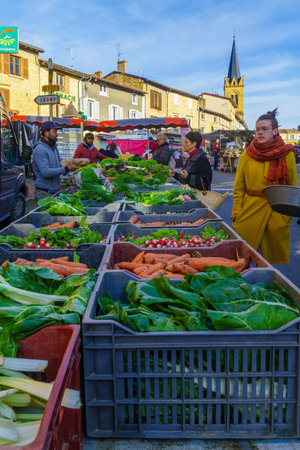 Le-Bois-de-Oingt, France - May 07, 2019: French market scene with sellers and shoppers in Le-Bois-de-Oingt, Beaujolais, Rhone department, Franceのeditorial素材