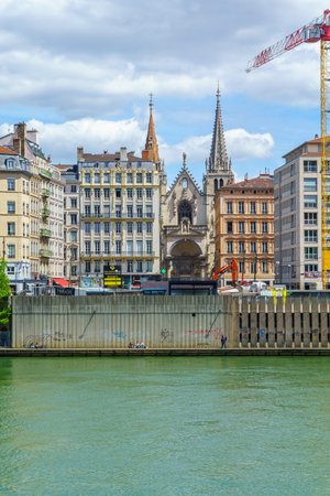 Lyon, France - May 10, 2019: The Saone River, colorful houses and Saint-Nizier church, in Lyon, Franceのeditorial素材