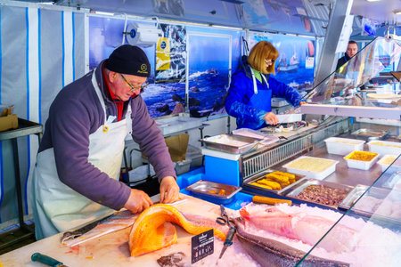 Le-Bois-de-Oingt, France - May 07, 2019: French market scene with fish sellers in Le-Bois-de-Oingt,...