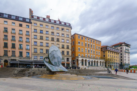 Lyon, France - May 09, 2019: View of the Louis Pradel square, and a statue (La Fontaine dIpousteguy), with locals and visitors, in Lyon, Franceのeditorial素材